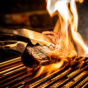 History of Grilling  Meat Meets Flame & Grills Get Smart - Broil King